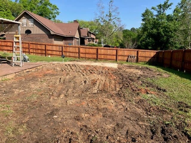 After shed removal in a backyard with the area cleared.