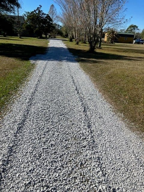 After gravel refresh on a long rural driveway with a fresh even surface.