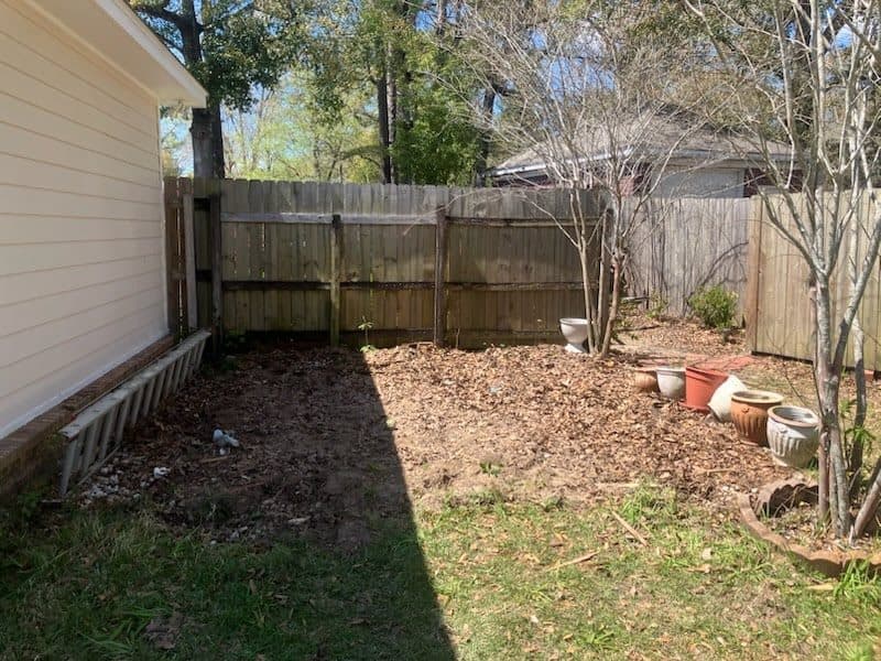 After junk removal with debris hauled away and the fence line cleaned up.