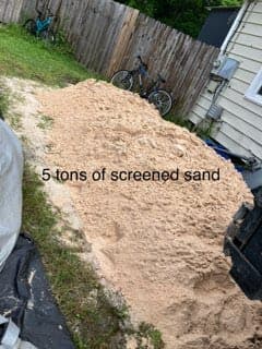 Screened soil delivered in truck bed for leveling and fill