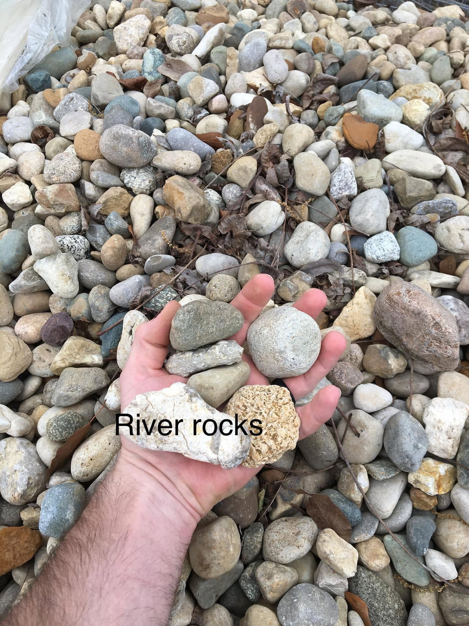 River rocks for decorative landscaping beds