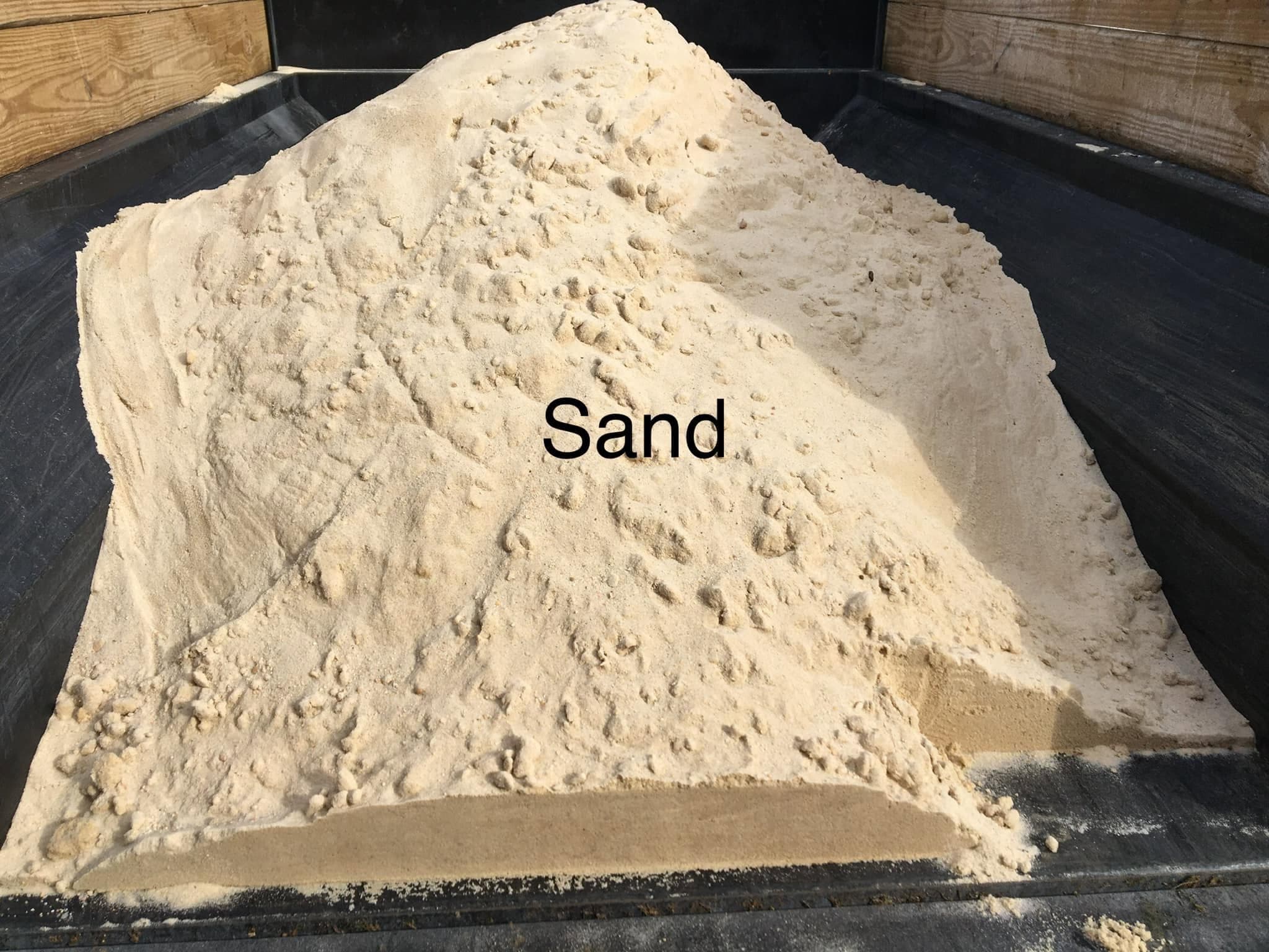 Sand load in truck bed for leveling and base preparation